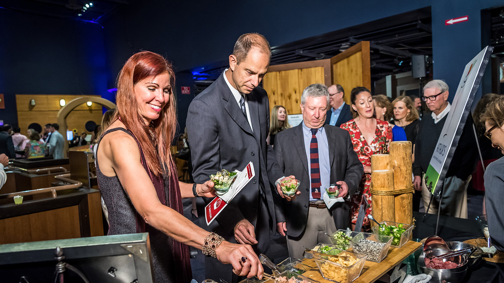 VIP guests fill their plates at the opening reception.