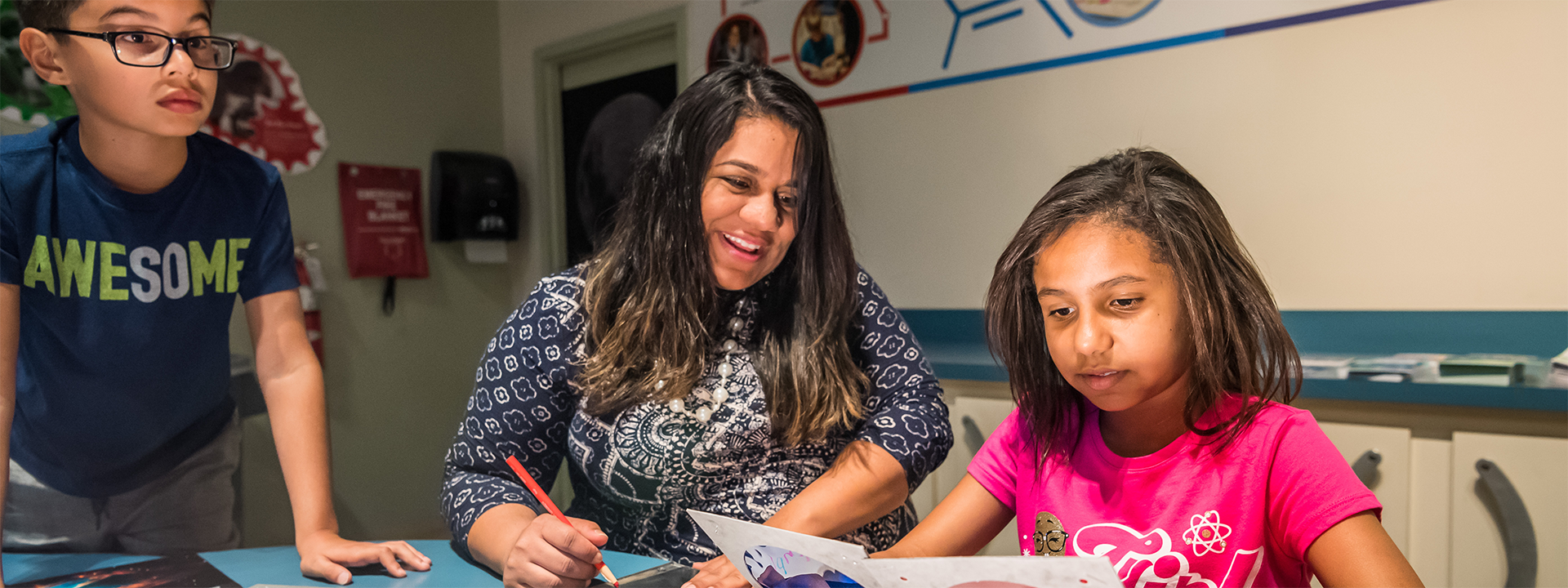 A family participates in an experiment together in Dr. Dare's Lab.