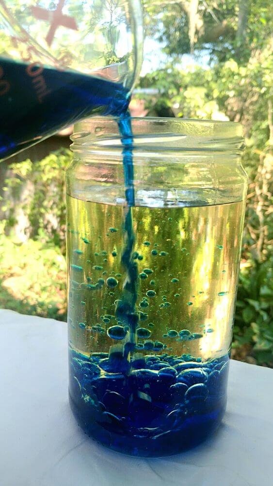 Mix dyed water with canola oil