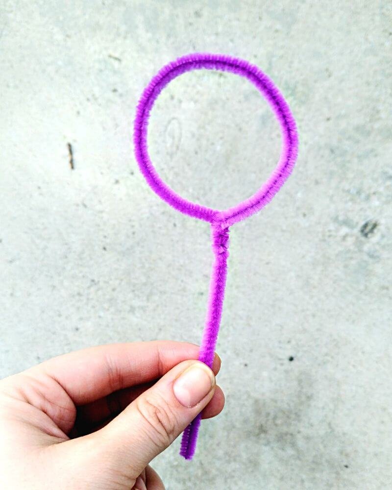 pink pipecleaner twisted into bubble wand