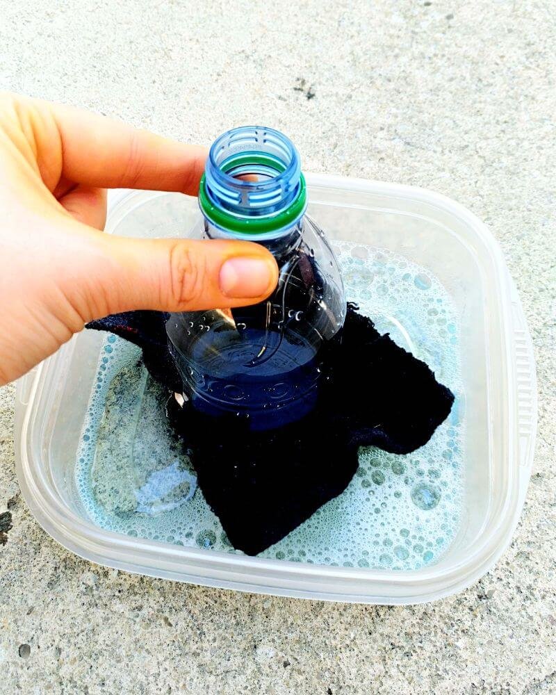 Dip water bottle into bubble solution