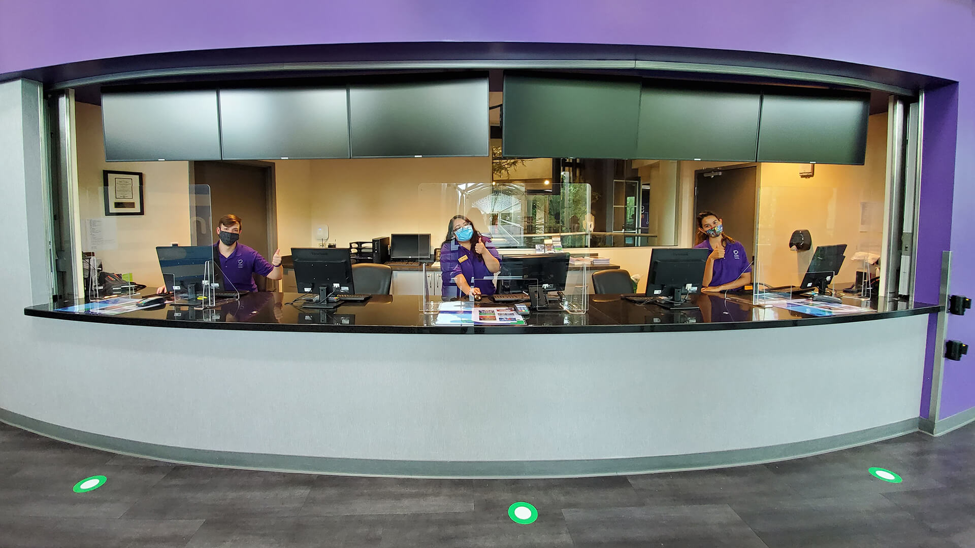 Image of OSC Admissions team in box office behind new plexiglass barriers.