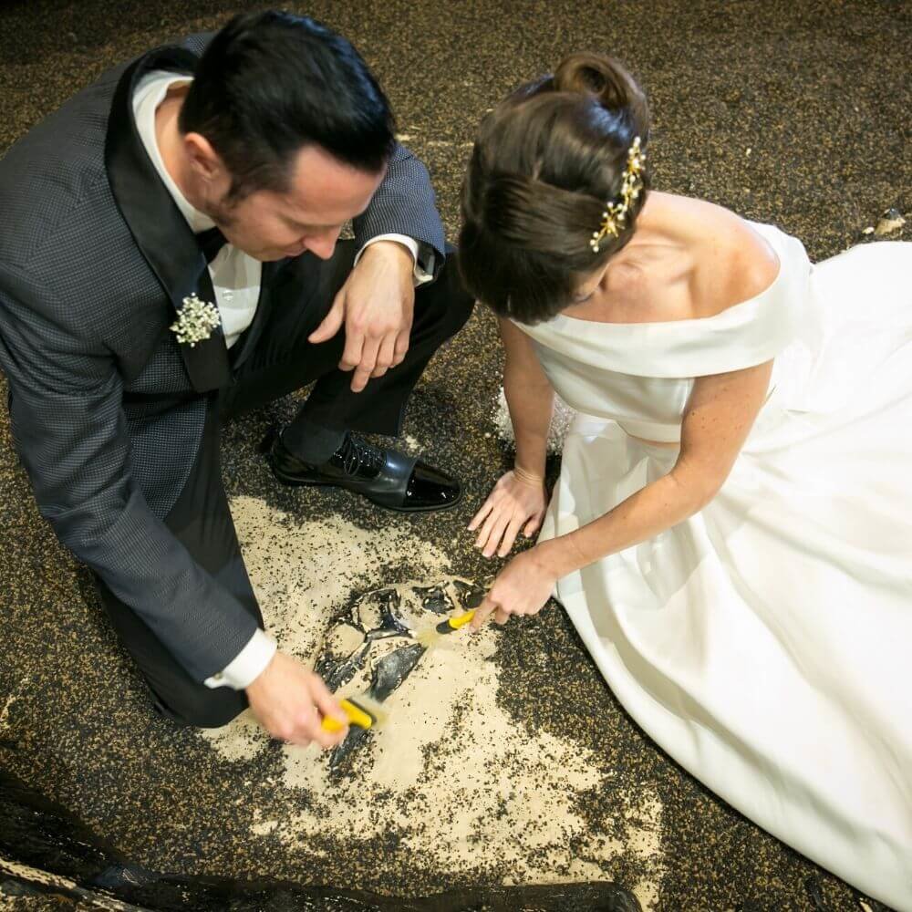 dinosaur wedding- dig pit couple