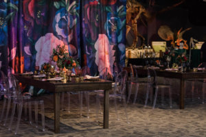 tables in front of a flower curtain backdrop