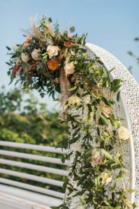 Flowers arranged on a crescent moon structure 