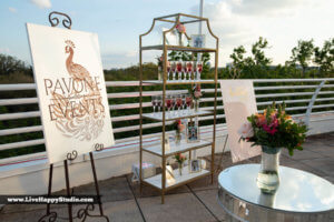 A display of signs and flowers for Pavone wedding services 