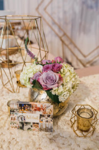 a close up of a decorated table with flowers and candles at Central Florida wedding showcase 