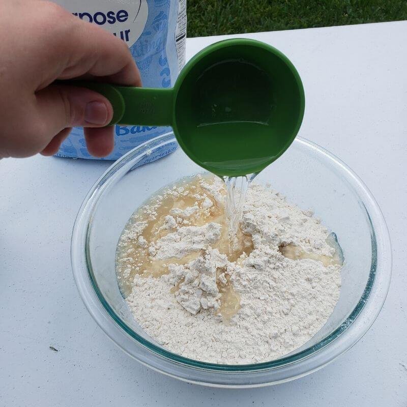 Add liquid ingredients to moon sand