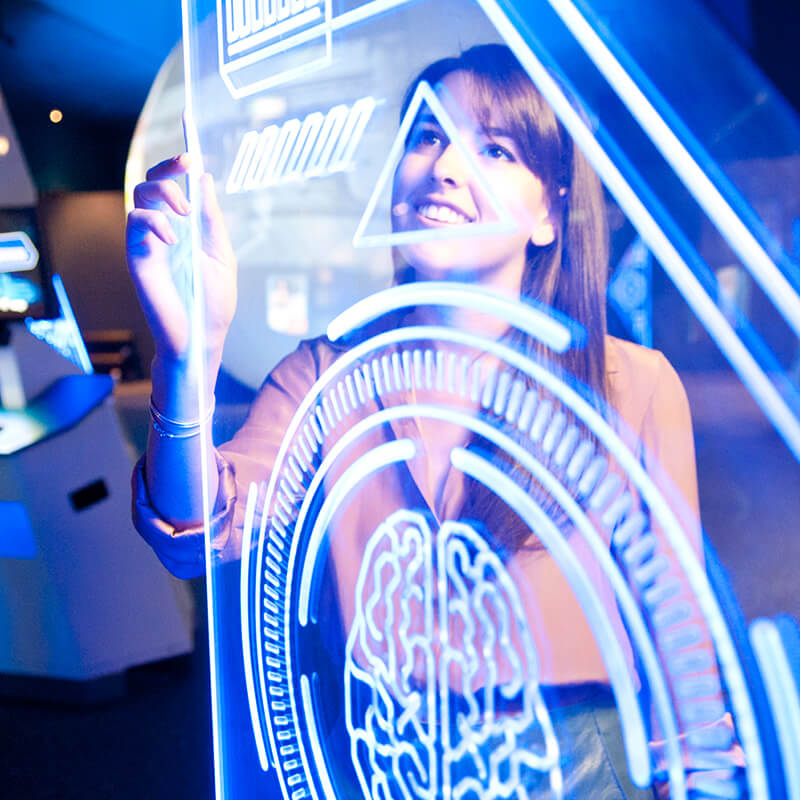 Science Fiction, Science Future - guest interacting with glowing acrylic panel.