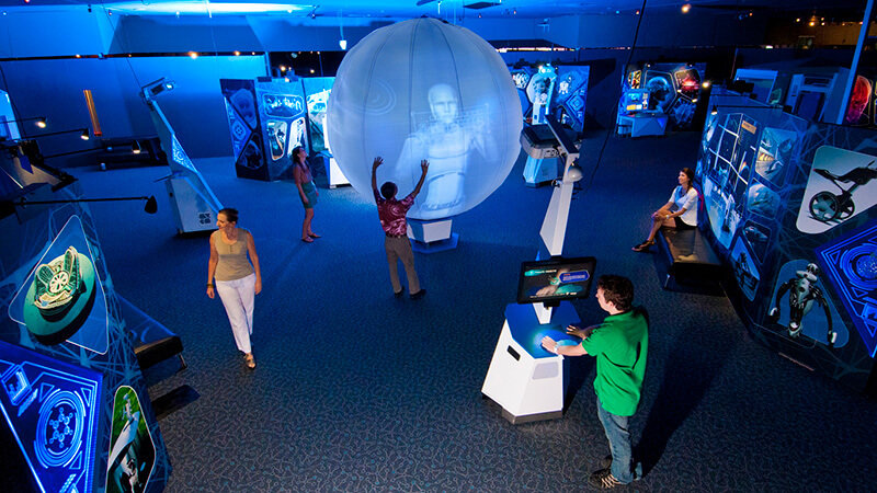 Science Fiction, Science Future - wide shot of room with video projected on large floating ball.