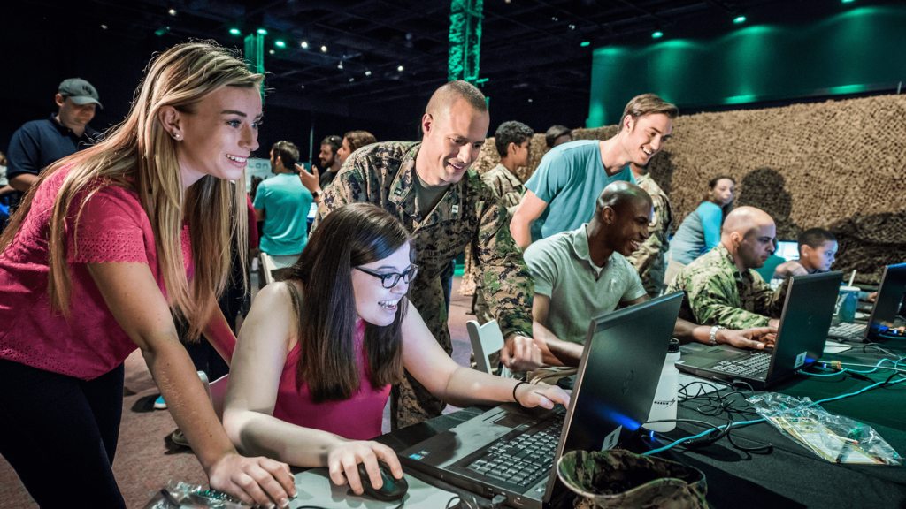 Guests test military simulators at the Otronicon technology event.