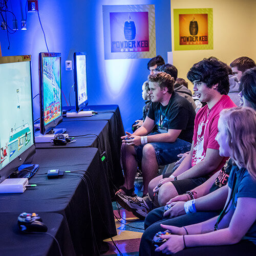 Young Adults in a video game competition at Otronicon