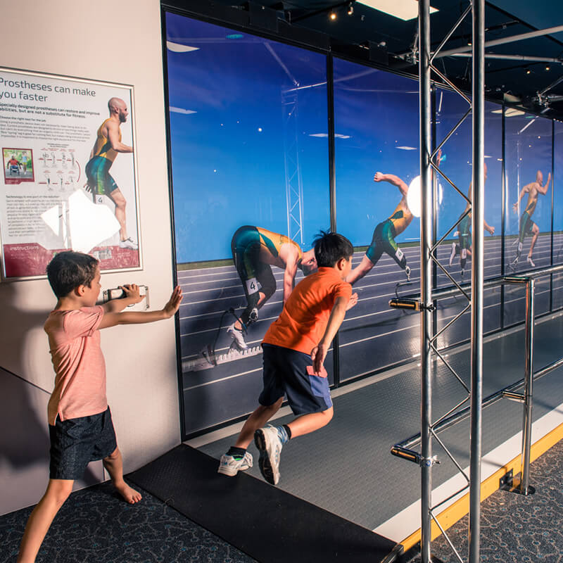 Children in running test simulator in Bionic Me exhibit.