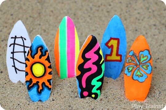 a photo of small colorful foam surfboards