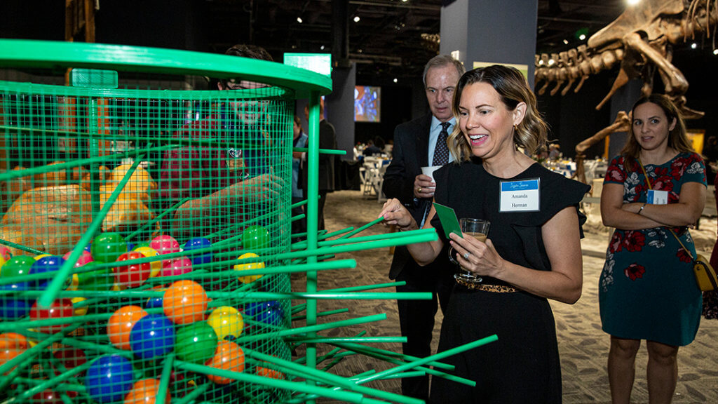 Inspire Science Breakfast guest engaged in an event challenge.