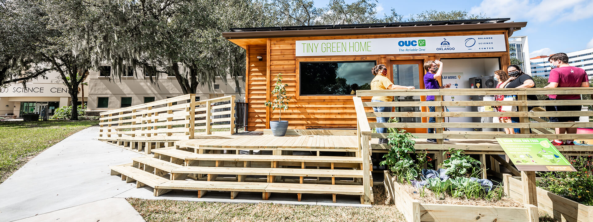 Guests touring a Tiny Green Home at Orlando Science Center