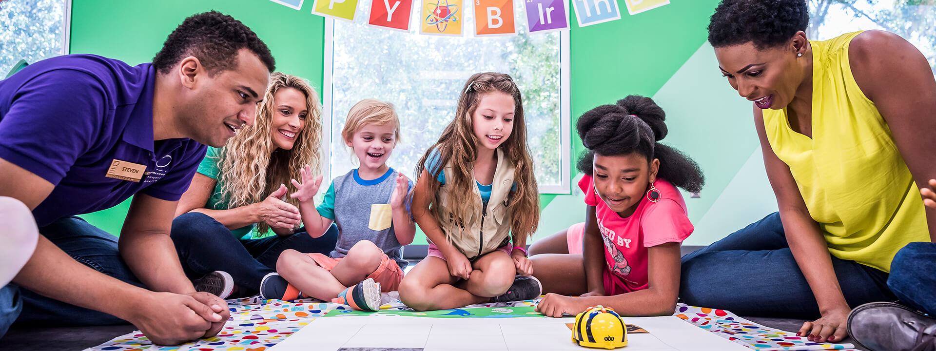 a group of people sitting on the floor