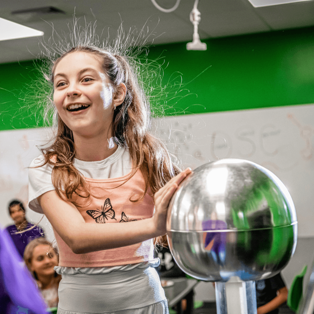 A young girl with de graaff generator 