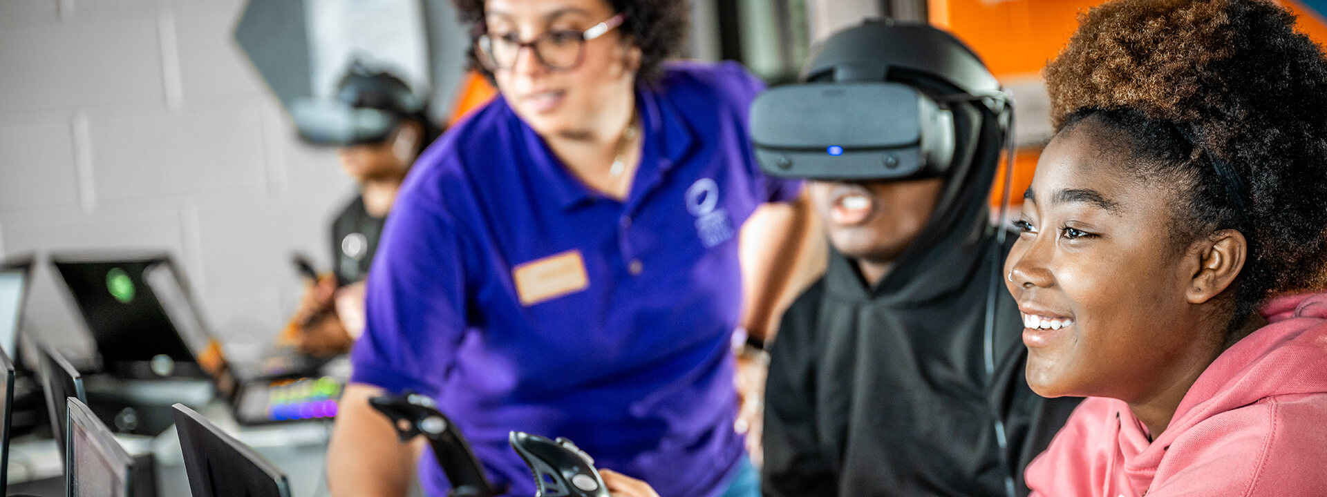 Students with VR simulator activity with OSC staff.