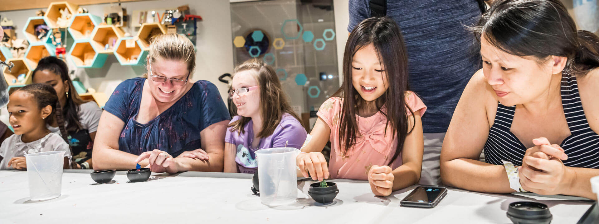 Guests enjoying maker activities in The Hive: A Makerspace.