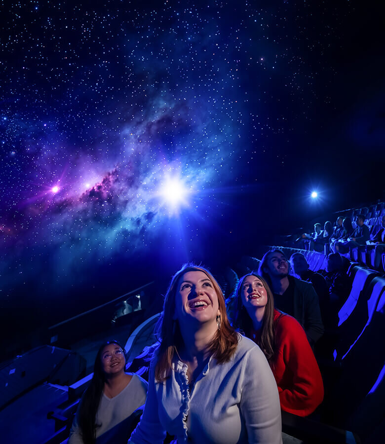 Three guests exude looks of wonder in The Dome by Dr. Phillips Charities.