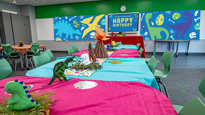 OSC_Birthday-Parties-2026_800x450-B A Fantastic Jurassic decorated Birthday Parties room at Orlando Science Center.