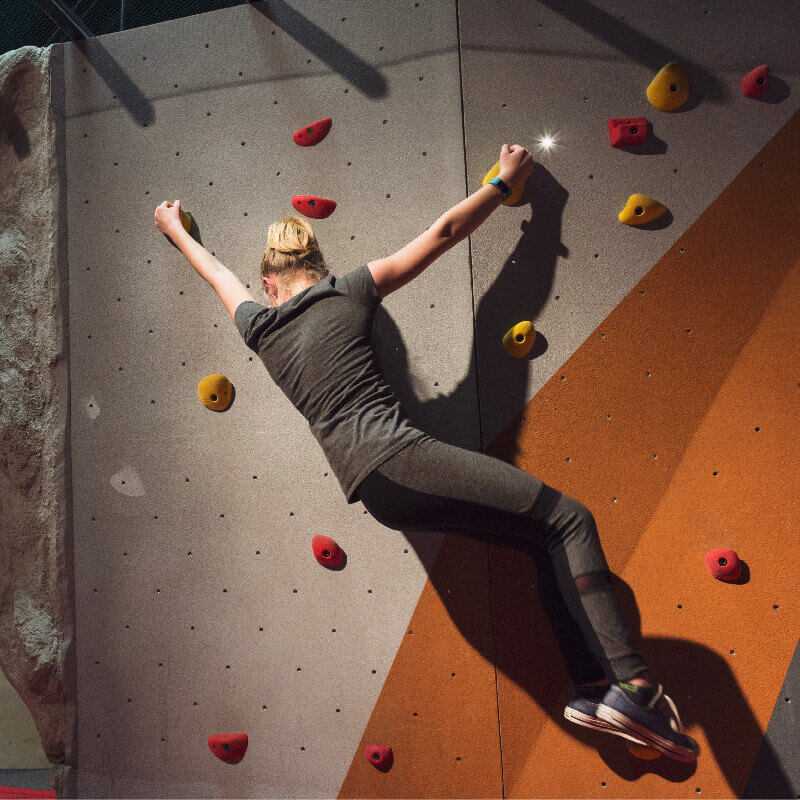 OSC_ExtremeSports__800x800_2 Child climbing rock wall in Extreme Sports exhibit.